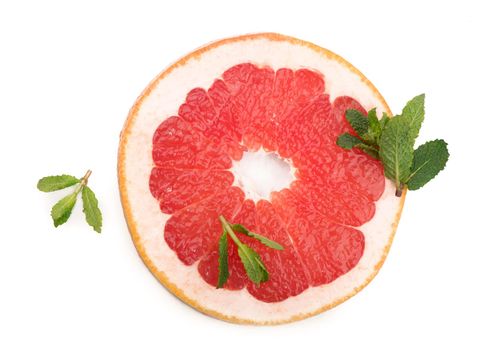 Juicy grapefruit pieces with fresh mint, close up