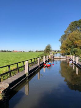 Canal lock with canoes in Friesland The Netherlands