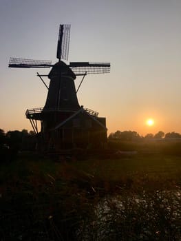 Sunset behind the windmill in IJlst Friesland, The Netherlands