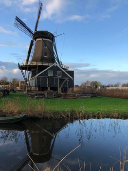 Windmill in IJlst during autumn Friesland The Netherlands