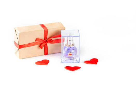 MOSCOW, RUSSIA - JAN 7, 2021: Eclat Lanvin perfume bottle in packaging and valentine's day gift on white background