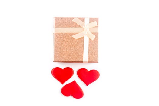 Valentine or other holiday present with red hearts and gifts box isolated on white background