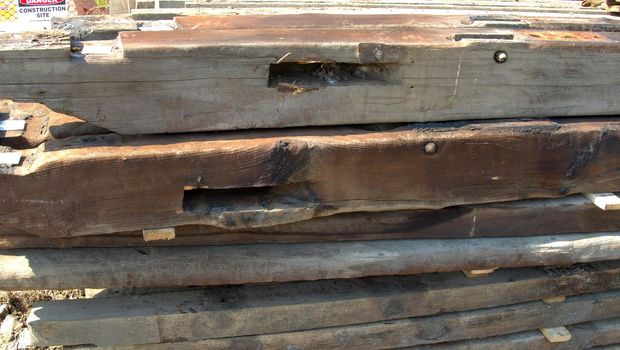 An Old Timber Frame Lumber Being Carefully Laid and Stored for Restoration