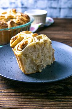 A piece of apple pie with cinnamon on blue plate. Top views with clear space.