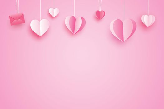 Valentines day background for greeting cards with paper hearts hanging on pink pastel.