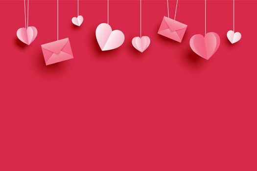 Valentines day background for greeting cards with paper hearts hanging on red pastel.