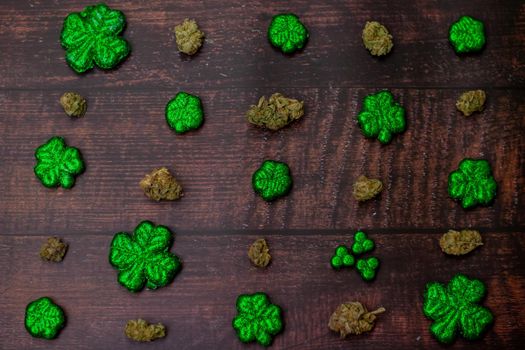 Glitter Covered Four Leaf Clovers For Saint Pattys Day in a Diagonal Pattern With Cannabis Nugs