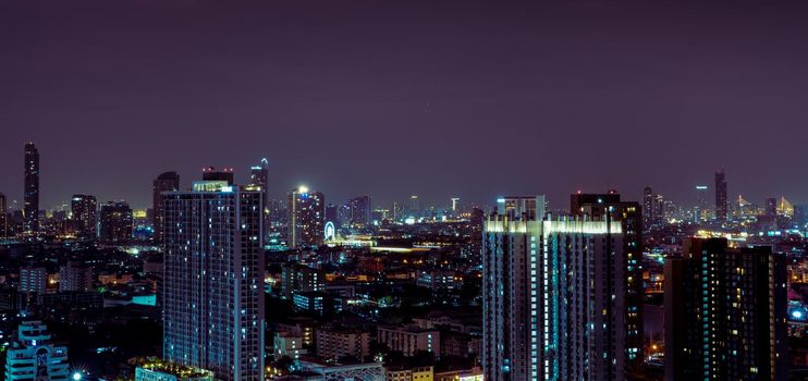 Cityscape of modern building in the night. Modern architecture office building. Skyscraper with beautiful evening sky. Business and financial center building. Apartment in the city with night light.