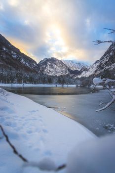 Idyllic winter landscape: Frosty lake and mountains. Buntausee
