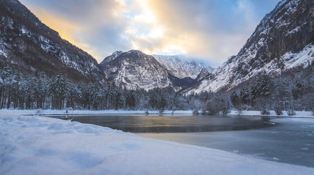 Idyllic winter landscape: Frosty lake and mountains. Buntausee