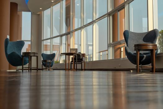 Bangkok, Thailand - Jan 14, 2021 : The new normal for common area in condominium. The seats were set separately according to social distancing policy for the spread of covid-19 prevention. No focus, specifically.
