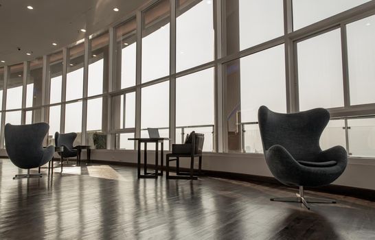 Bangkok, Thailand - Jan 14, 2021 : The new normal for common area in condominium. The seats were set separately according to social distancing policy for the spread of covid-19 prevention. No focus, specifically.