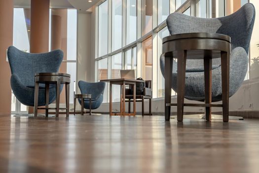 Bangkok, Thailand - Jan 14, 2021 : The new normal for common area in condominium. The seats were set separately according to social distancing policy for the spread of covid-19 prevention. No focus, specifically.