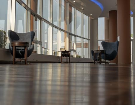 Bangkok, Thailand - Jan 14, 2021 : The new normal for common area in condominium. The seats were set separately according to social distancing policy for the spread of covid-19 prevention. No focus, specifically.
