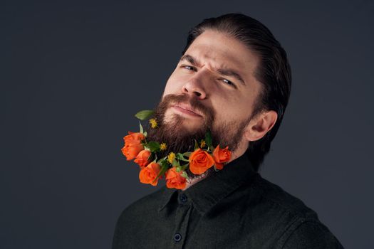Cute man decorating in the city flowers romance gift. High quality photo