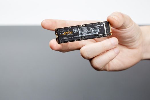 Moscow, Russia - Dec 25, 2020: Ssd hard disk in technician's hand.