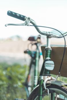 Front picture of a vintage retro bike, head reflectors and blurry background