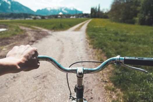 Closeup picture of a vintage bicycle handlebar and breaks outdoors, blurred background