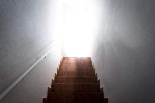 Basement stairs with balustrade. Natural bright sunlight.