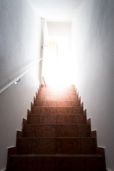 Basement stairs with balustrade. Natural bright sunlight.