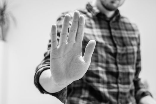 Man showing stop gesture, close up of the hand