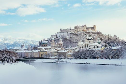 Panorama of Salzburg in winter: Snowy historical center, sunshine