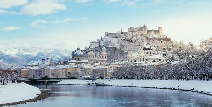 Panorama of Salzburg in winter: Snowy historical center, sunshine