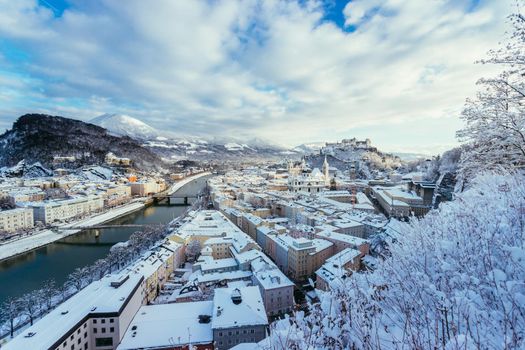 Panorama of Salzburg in winter: Snowy historical center, sunshine