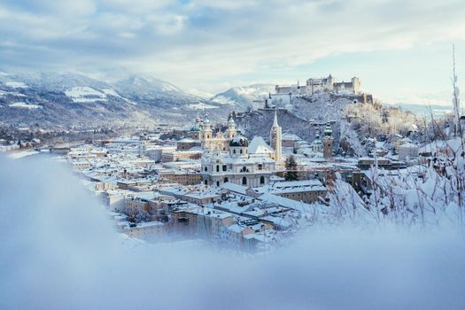 Panorama of Salzburg in winter: Snowy historical center, sunshine