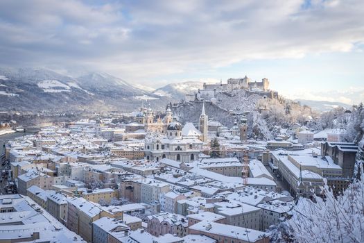 Panorama of Salzburg in winter: Snowy historical center, sunshine