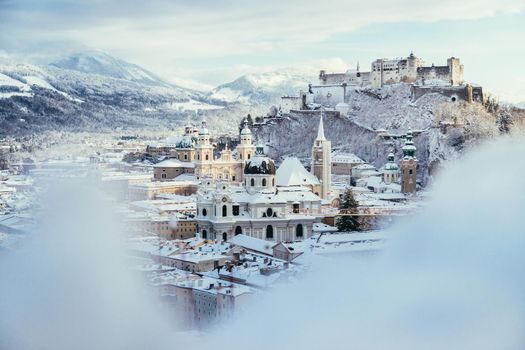 Panorama of Salzburg in winter: Snowy historical center, sunshine