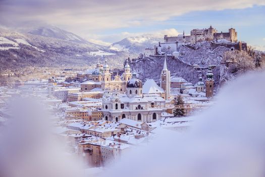 Panorama of Salzburg in winter: Snowy historical center, sunshine