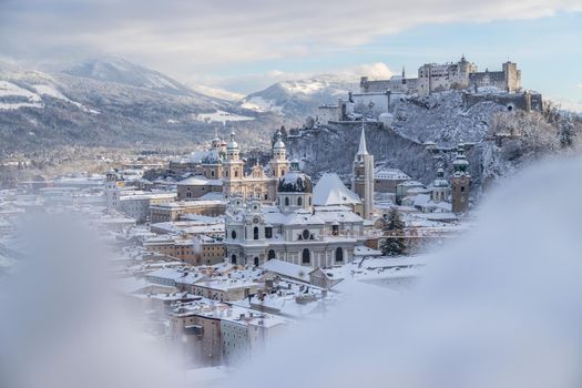 Panorama of Salzburg in winter: Snowy historical center, sunshine