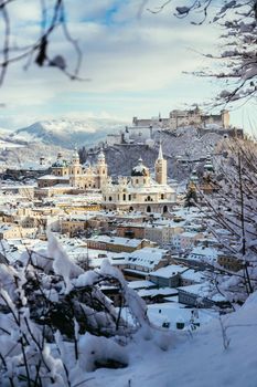 Panorama of Salzburg in winter: Snowy historical center, sunshine