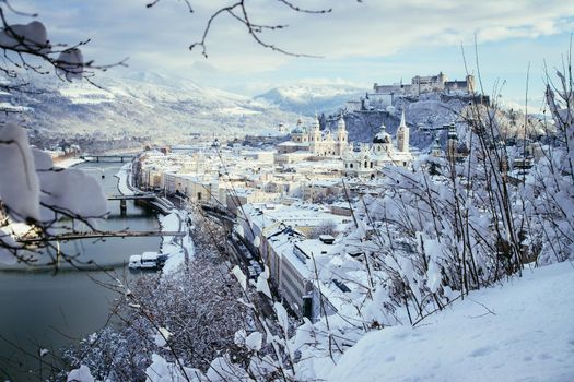 Panorama of Salzburg in winter: Snowy historical center, sunshine