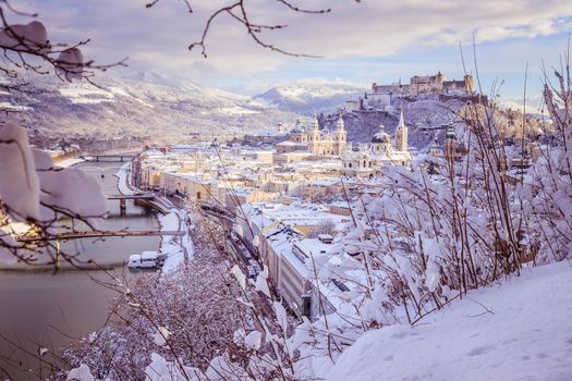 Panorama of Salzburg in winter: Snowy historical center, sunshine
