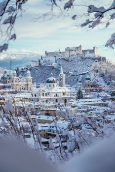 Panorama of Salzburg in winter: Snowy historical center, sunshine