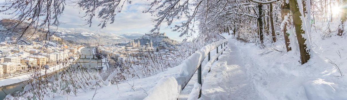 Walking promenade in Salzburg, snowy winter landscape