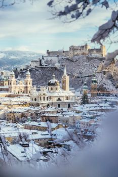 Panorama of Salzburg in winter: Snowy historical center, sunshine