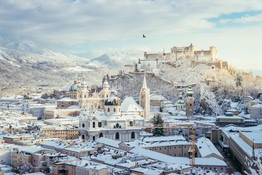 Panorama of Salzburg in winter: Snowy historical center, sunshine