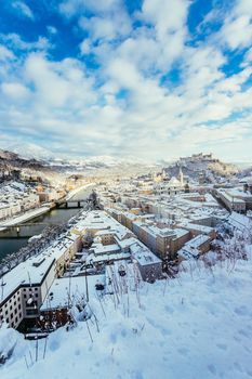 Panorama of Salzburg in winter: Snowy historical center, sunshine