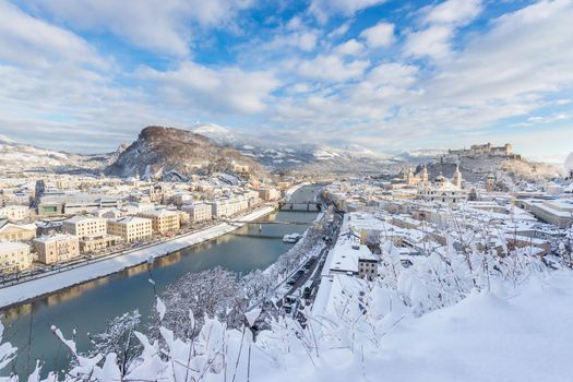 Panorama of Salzburg in winter: Snowy historical center, sunshine