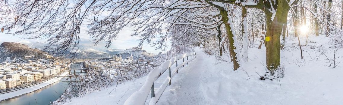 Walking promenade in Salzburg, snowy winter landscape