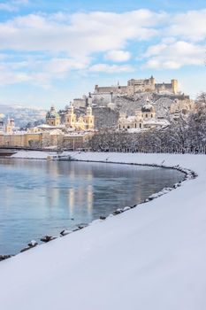 Panorama of Salzburg in winter: Snowy historical center, sunshine