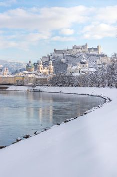 Panorama of Salzburg in winter: Snowy historical center, sunshine