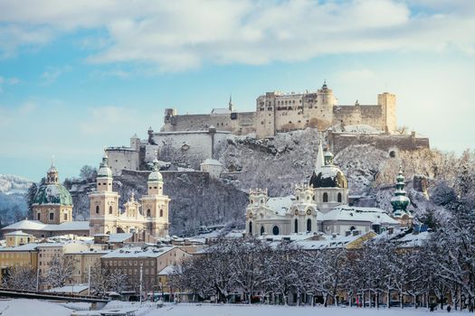 Panorama of Salzburg in winter: Snowy historical center, sunshine