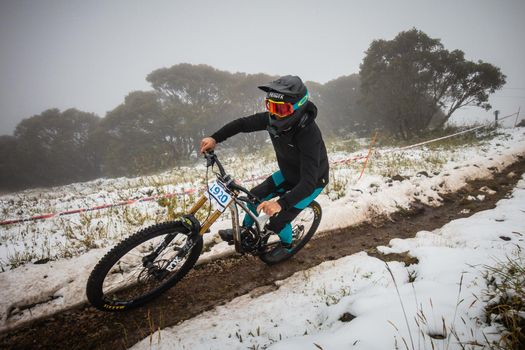 Mt Buller, Australia - January 16 2021: Practice round for the Victorian Downhill Mountain Bike Series after a summer snow storm