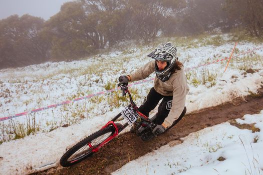 Mt Buller, Australia - January 16 2021: Practice round for the Victorian Downhill Mountain Bike Series after a summer snow storm