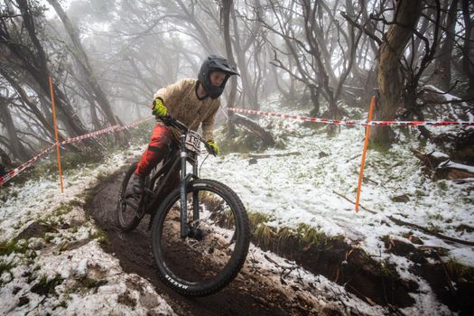 Mt Buller, Australia - January 16 2021: Practice round for the Victorian Downhill Mountain Bike Series after a summer snow storm