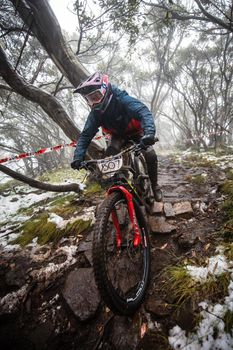 Mt Buller, Australia - January 16 2021: Practice round for the Victorian Downhill Mountain Bike Series after a summer snow storm